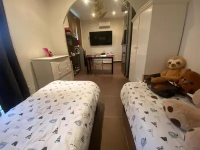 a bedroom with a bed with a teddy bear on it at Maison de charme in Sotta