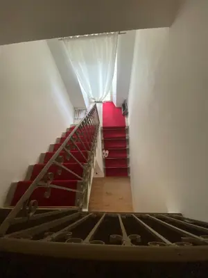 an attic room with a bed and a window at Maison de charme in Sotta