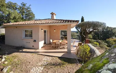 a small house with a table in front of it at Cozy Home In Porto-Vecchio in Porto-Vecchio