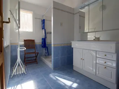 a bathroom with a sink and a toilet and a shower at Tozzasim in Pianottoli-Caldarello