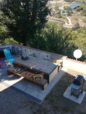 an overhead view of a patio with a table and chairs at Kallista 1 in San-Giuliano