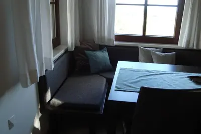 a room with a couch and a table and a window at Kallista 1 in San-Giuliano