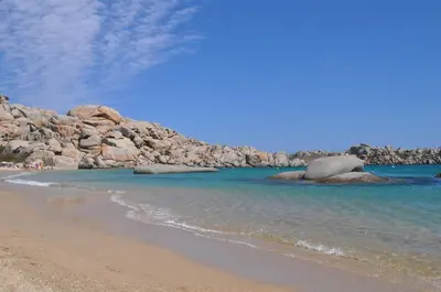 a beach with rocks in the water and the ocean at La Perle du Valinco #Familial#Balcon#Piscine#Mer in Propriano