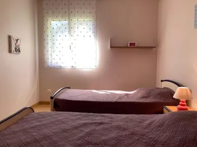 a bedroom with two beds and a window at Casa di Luiggi in Venaco