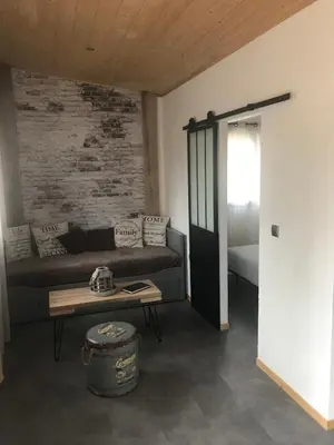 a living room with a couch and a table at L'Accugliente in Lecci