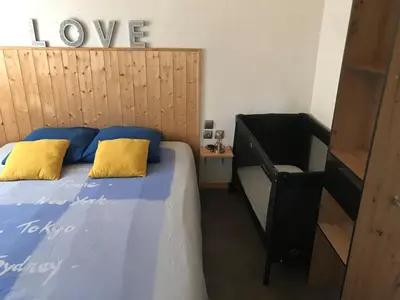 a bedroom with a bed with two yellow pillows at L'Accugliente in Lecci