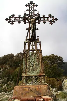 a cross sitting on top of a hill at Kallista 2 in San-Giuliano