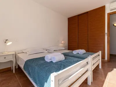 a bedroom with two beds with towels on them at Villa Villa Capicciola by Interhome in Sainte-Lucie de Porto-Vecchio