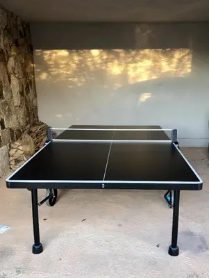 a black ping pong table in a room at Ecrin de Pinarello in Pinarellu