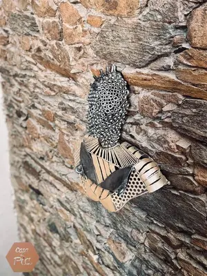 a bird on the side of a stone wall at Casa di Pia, demeure Corse du XIXème in Olmeta-di-Tuda