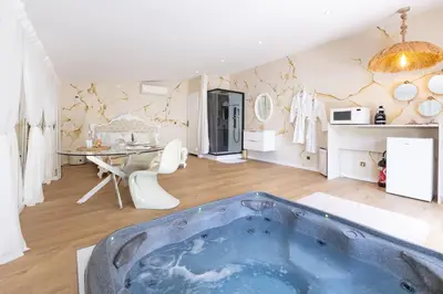 a bathroom with a bath tub in a room at Hacienda d Amore in Oletta