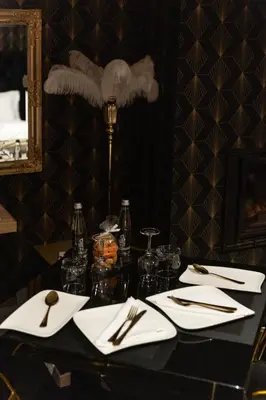 a table with white napkins and silverware on it at Hacienda d Amore in Oletta