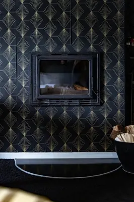 a blue tiled wall with a fireplace in a room at Hacienda d Amore in Oletta
