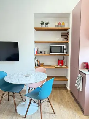 a small dining room with a table and chairs at A Casa Grandval - Ajaccio in Ajaccio