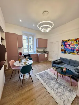 a living room with a couch and a table at A Casa Grandval - Ajaccio in Ajaccio