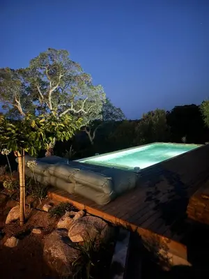 a large inflatable swimming pool with avertisementatronstrationstrationstrationstrationstrationstration at Bohemian Villa with Heated Pool near beach in Lecci