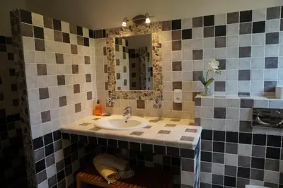 a bathroom with a sink and a mirror at Chambre d'Hôtes Domaine Pero Longo in Sartène
