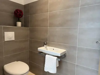 a bathroom with a toilet and a sink at kaki in Pinarellu