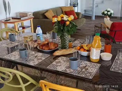 a table with a bunch of food on it at Bord de mer, pieds dans l'eau, vue panoramique in San-Nicolao