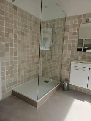 a shower with a glass door in a bathroom at 2Calm in Viggianello
