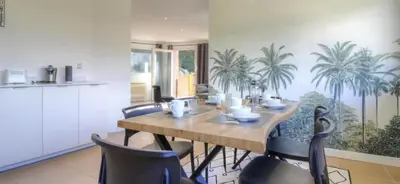 a dining room with a wooden table and chairs at 2Calm in Viggianello