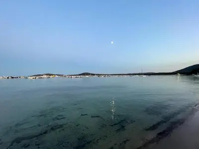 a view of a large body of water at ruscana in Pinarellu