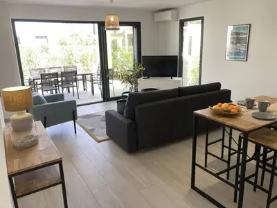 a living room with a couch and a table at tianau in Lecci