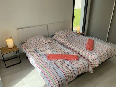 a bed with two towels on it in a bedroom at tianau in Lecci