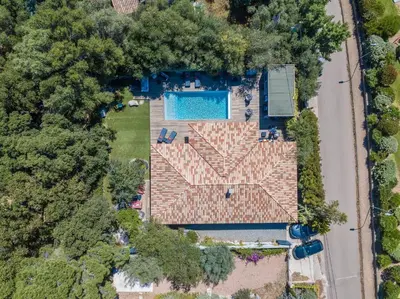 an overhead view of a house with a swimming pool at meli melo in Pinarellu