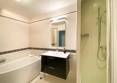a bathroom with a sink and a tub and a shower at alba in Pinarellu
