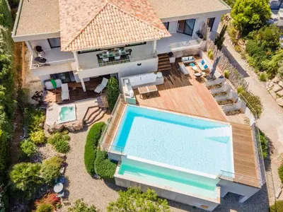 an aerial view of a house with a swimming pool at alba in Pinarellu