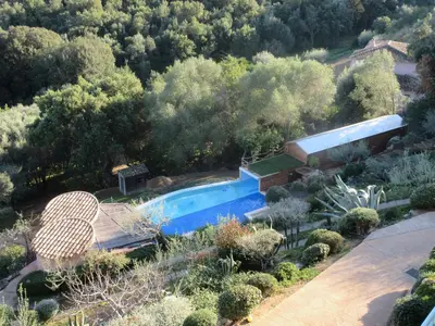 an aerial view of a swimming pool in a garden at la grande piscine in Porto-Vecchio
