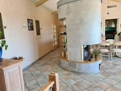 a kitchen with a large pizza oven in a room at la grande piscine in Porto-Vecchio