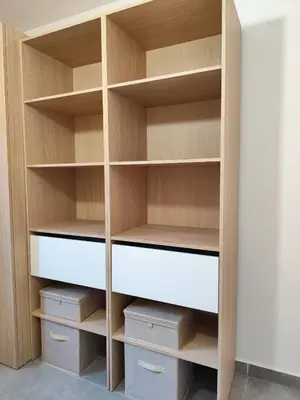 a closet with wooden shelves and drawers at T2 Cyprien, Climatisé, piscines, resto, Plages 2-4 pers in Lecci