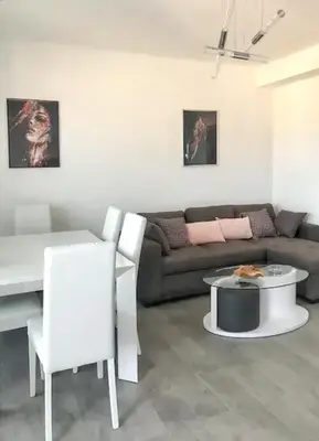 a living room with a couch and a table at Appartement à Ajaccio avec vue sur la mer in Ajaccio