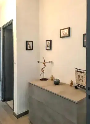 a room with a table with a sculpture on it at Appartement à Ajaccio avec vue sur la mer in Ajaccio