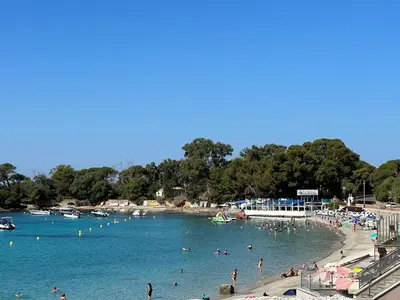a group of people in the water at a beach at Studio vue mer in Ajaccio