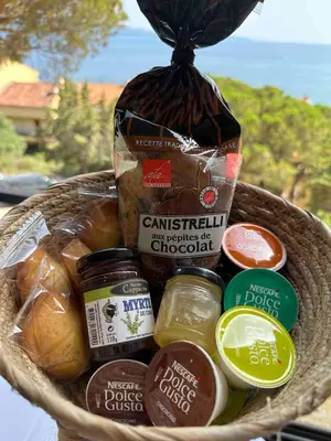 a basket filled with different types of food at Studio vue mer in Ajaccio