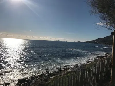 a view of a body of water with a fence at Loft Place du Diamant Hyper centre ville Plage 50m in Ajaccio
