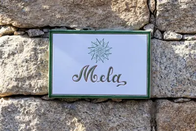 a sign on a rock with a snowflake on it at A Mandria di Murtoli in Sartène