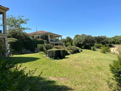 a house with a large yard with bushes at Locations I Carboni - villa 2 chambres in Sollacaro