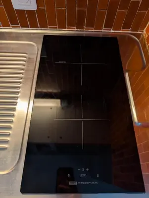 a close up of a microwave in a kitchen at Au Châtaignier Corse in Vico