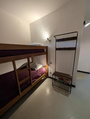 a room with two bunk beds and a shelf at Au Châtaignier Corse in Vico
