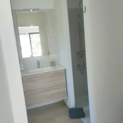 a bathroom with a sink and a mirror at suara in Pinarellu