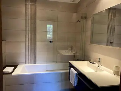 a bathroom with a sink and a bath tub at t3cj n14 in Pinarellu