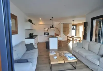 a living room with a couch and a coffee table at alcudina in Zonza