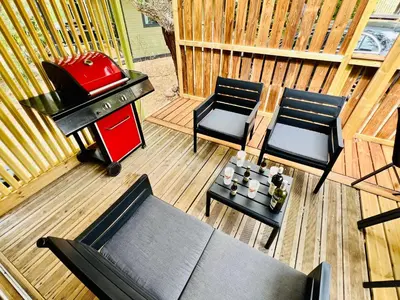 an overhead view of a patio with a grill and chairs at Chalet A tout confort à deux pas des plages in Pianottoli-Caldarello