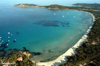 an aerial view of a beach with boats in the water at Un cocon de détente entre mer et nature in Zonza