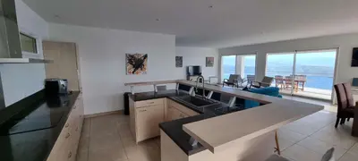 a kitchen with a sink and a counter top at Villa de standing piscine chauffée vue mer Corse du sud in Coti-Chiavari