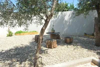 a living room with a couch and a table at Appartement Lido de la Marana in Lucciana